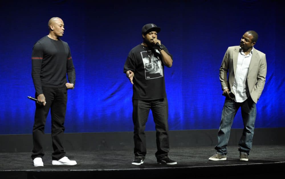 N.W.A. members Dr. Dre, left, and Ice Cube, center, two of the subjects of the upcoming biographical drama &quot;Straight Outta Compton,&quot; discuss the film with director F. Gary Gray during the Universal Pictures presentation at CinemaCon 2015 in April. (Chris Pizzello/Invision/AP)