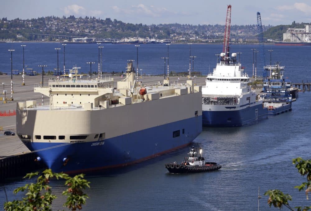 On May 6, 2015, two ships sit moored at Seattle's Terminal 5, including the Shell support vessel Aiviq, where Royal Dutch Shell wants to park two massive Arctic oil drilling rigs. (Elaine Thompson/AP)