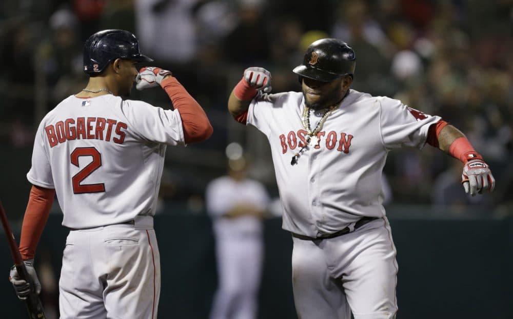 Boston Red Sox Pablo Sandoval, right, celebrates with Xander Bogaerts after Sandoval hit a home run  in the eleventh inning on May 11, 2015. (Ben Margot/AP)