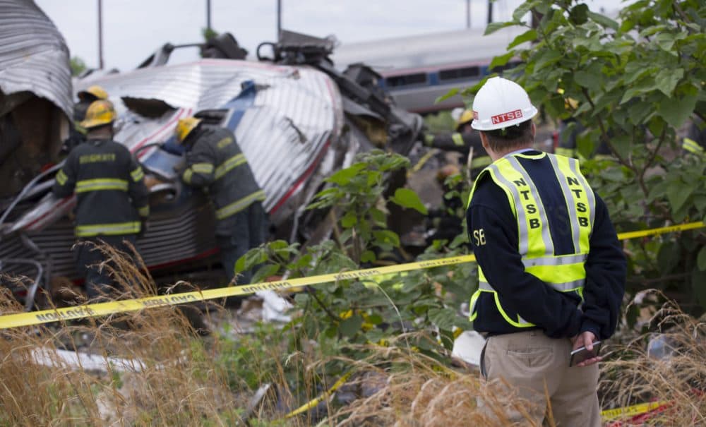 NTSB member Robert Sumwalt works on the scene of the Amtrak Train #188 derailment on May 13, 2015 in Philadelphia, Pennsylvania. (NTSB via Getty Images)
