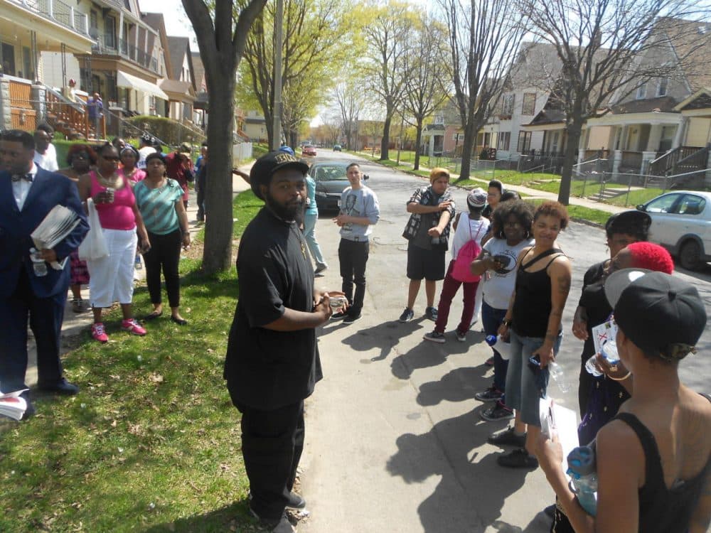 Members of the Black Love Matters Movement convene during a march through a north side neighborhood. (LaToya Dennis)