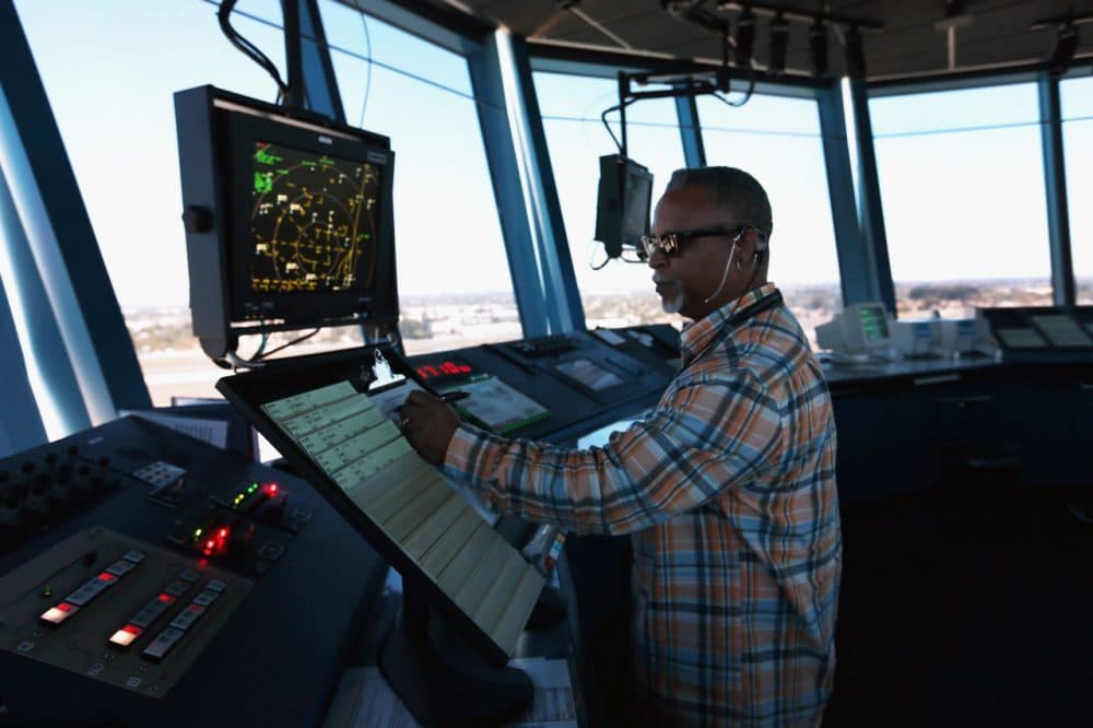 Air-traffic controller Robert Moreland works in the control tower at Opa-locka airport on March 4, 2013 in Opa-locka, Florida. (Joe Raedle/Getty Images)
