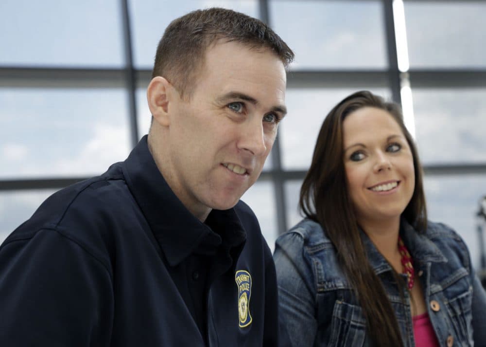 MBTA Police Officer Richard Donohue with his wife, Kim, in a 2013 file photo (Elise Amendola/AP)