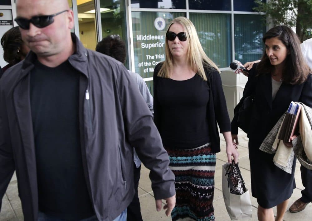 Aisling Brady McCarthy, center, leaves court with her attorney, Melinda Thompson, right, following a status hearing at Middlesex Superior Court in Woburn on Tuesday. McCarthy, a nanny from Ireland, is accused of killing a 1-year-old girl in her care two years ago. (Charles Krupa/AP)