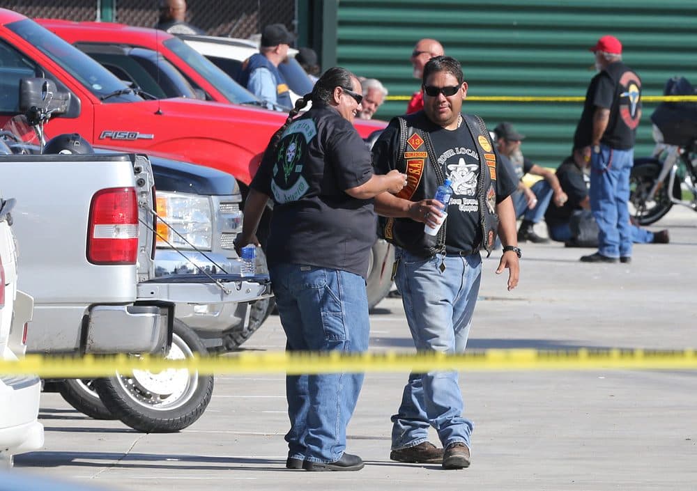 Authorities investigate a shooting in the parking lot of the Twin Peaks restaurant Sunday, May 17, 2015, in Waco, Texas. Authorities say that the shootout victims were members of rival biker gangs that had gathered for a meeting. (Jerry Larson/AP)