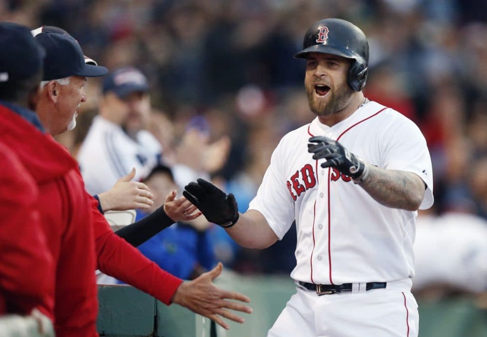Red Sox's Mike Napoli, right, celebrates his solo home run during the second inning  against the Los Angeles Angels in Boston, Saturday, May 23, 2015. (AP Photo/Michael Dwyer)