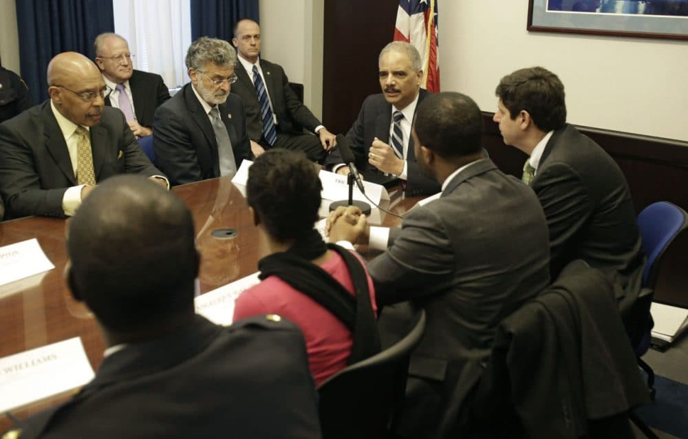 U.S. Attorney General Eric Holder holds a roundtable meeting with law enforcement, local officials, and community leaders to discuss the U.S. Department of Justice's report on excessive police force and violence in Cleveland, Dec. 4, 2014. Today, Cleveland waits for the Department of Justice's police statement. (Tony Dejak/AP)
