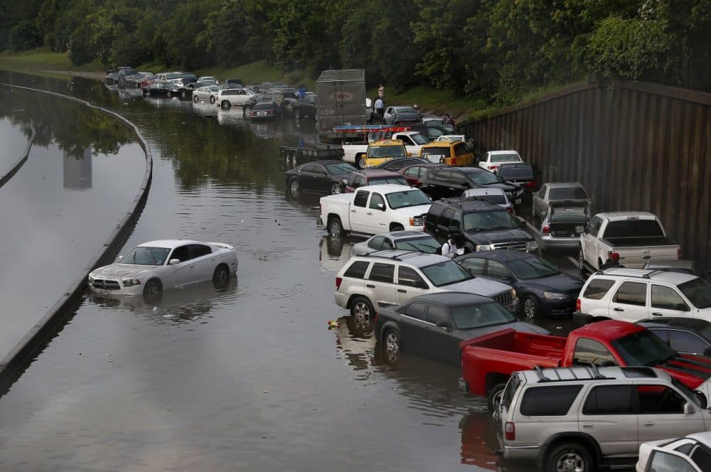 Vehicles left stranded on a flooded Interstate 45 in Houston, Texas on May 26, 2015. Heavy rains throughout Texas put the city of Houston under massive amounts of water, closing roadways and trapping residents in their cars and buildings, according to local reports. (Aaron M. Sprecher/AFP/Getty Images)