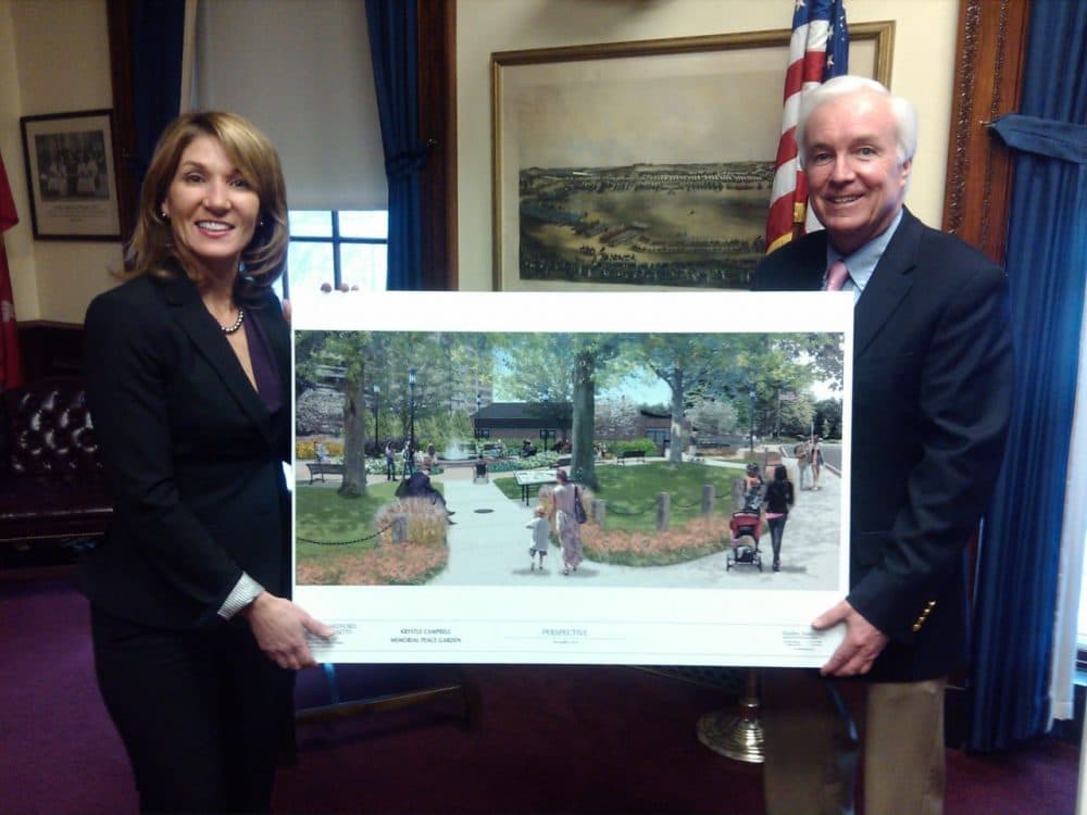 Mayor Michael McGlynn and Lt. Gov. Karyn Polito hold a photo of the Krystle Campbell Peace Garden. (Courtesy Lisa Evangelista)