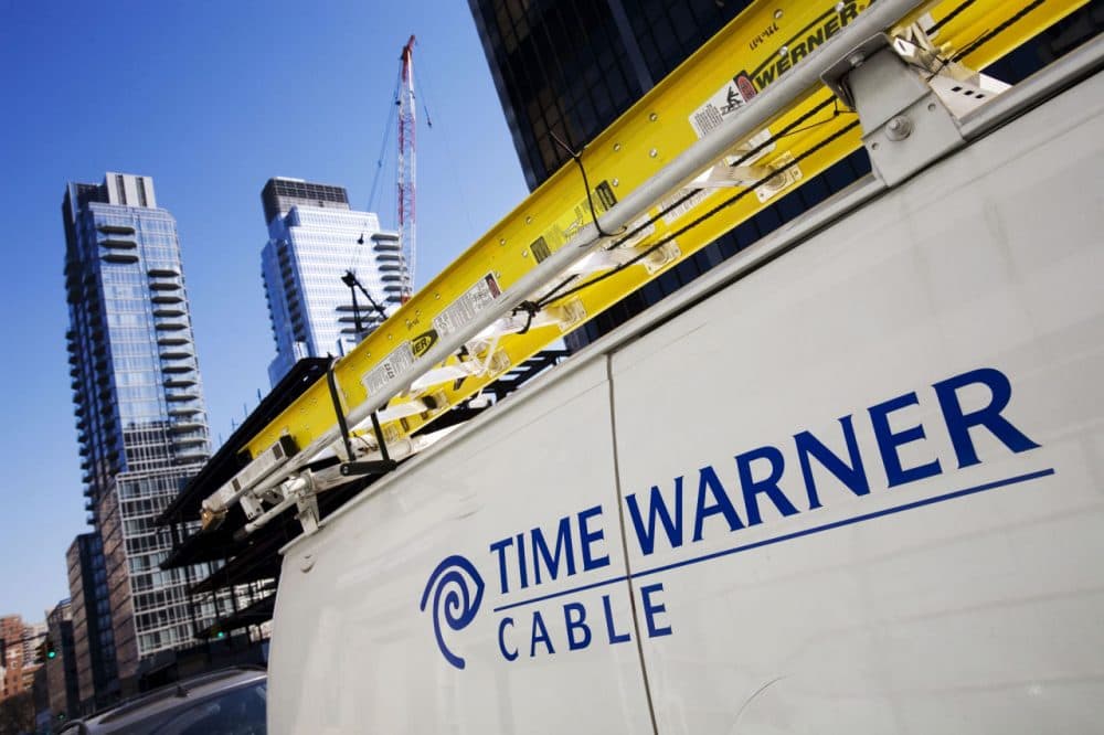 A Time Warner Cable truck is pictured in New York on Feb. 2, 2009. Charter Communications is close to buying Time Warner Cable. (Mark Lennihan/AP)