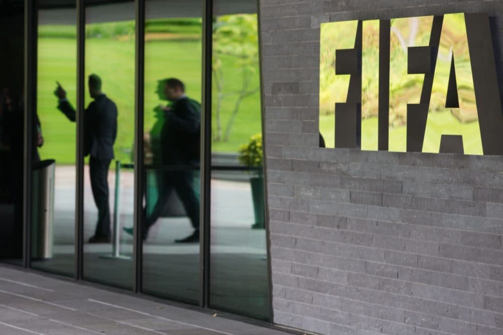 A FIFA logo sits next to the entrance to the FIFA headquarters on May 27, 2015 in Zurich, Switzerland. Swiss police on Wednesday raided a Zurich hotel to detain top FIFA football officials as part of a US investigation into corruption. (Philipp Schmidli/Getty Images)