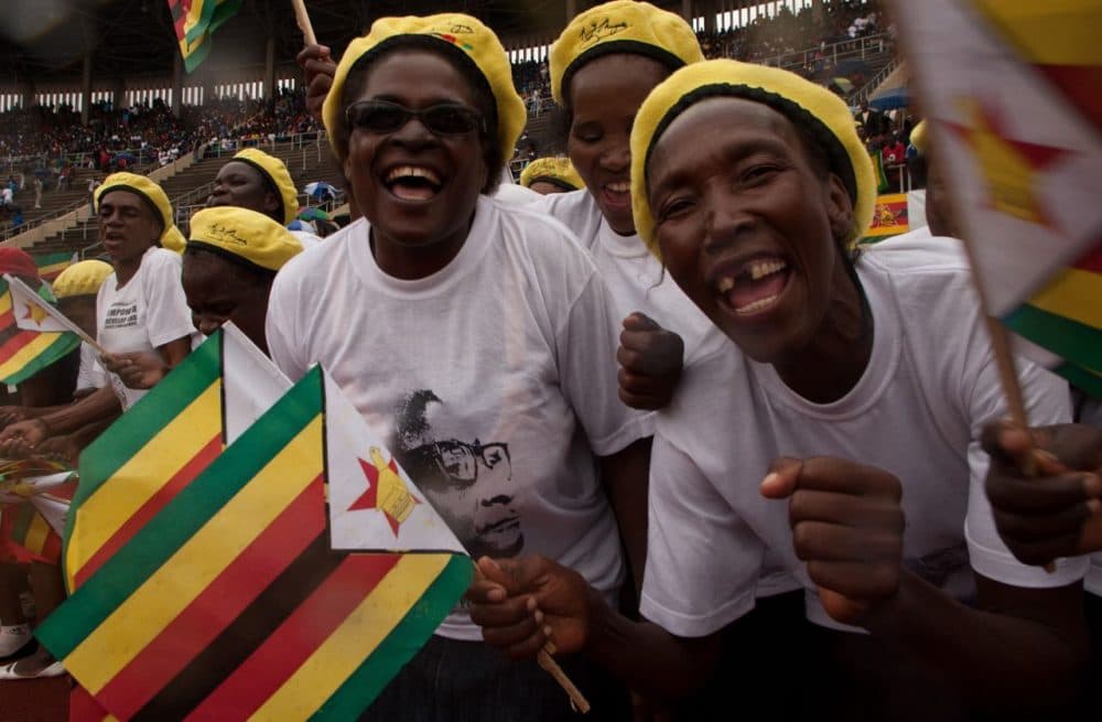 Supporters cheer during celebrations for Zimbabwe's 35th independence anniversary on April 18, 2015 in the capital, Harare, where President Robert Mugabe condemned ongoing anti-foreigner attacks in neighboring South Africa. (Jekesai Nijikizana/AFP/Getty Images)