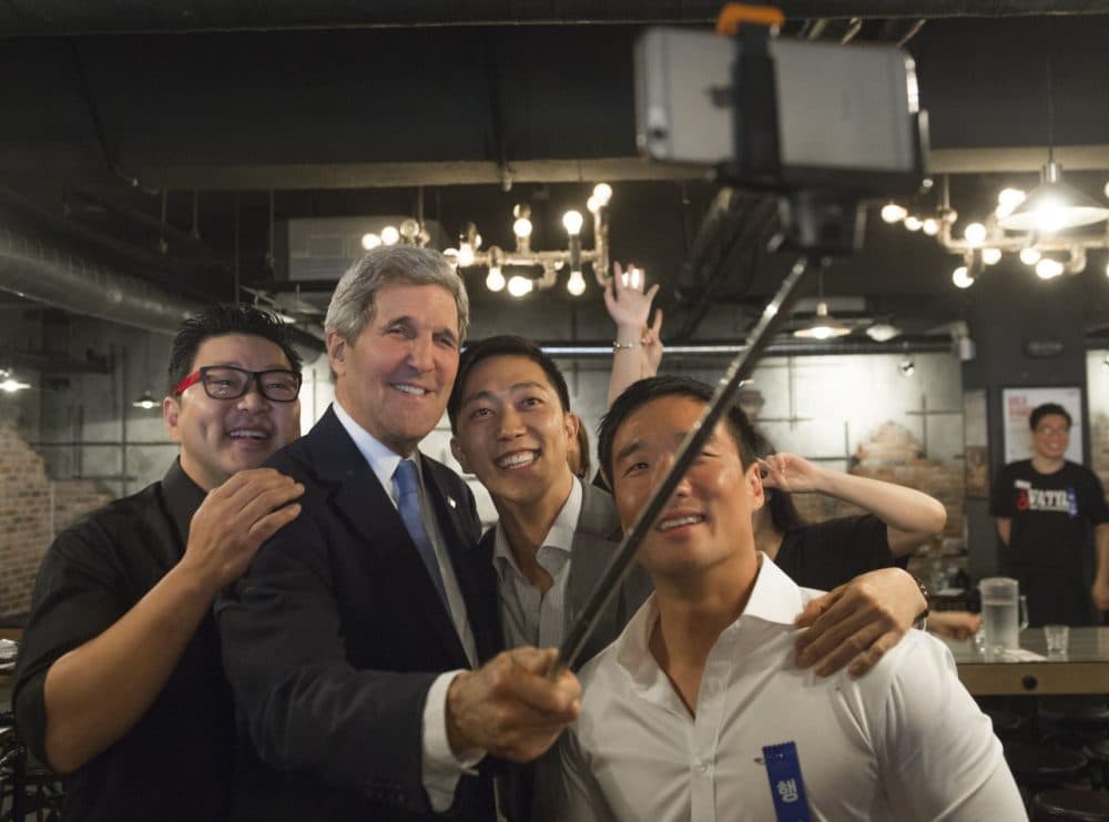 US Secretary of State John Kerry uses a &quot;selfie stick&quot; during a stop at the restaurant in Seoul, on May 18, 2015. (Saul Loeb/AFP/Getty Images)