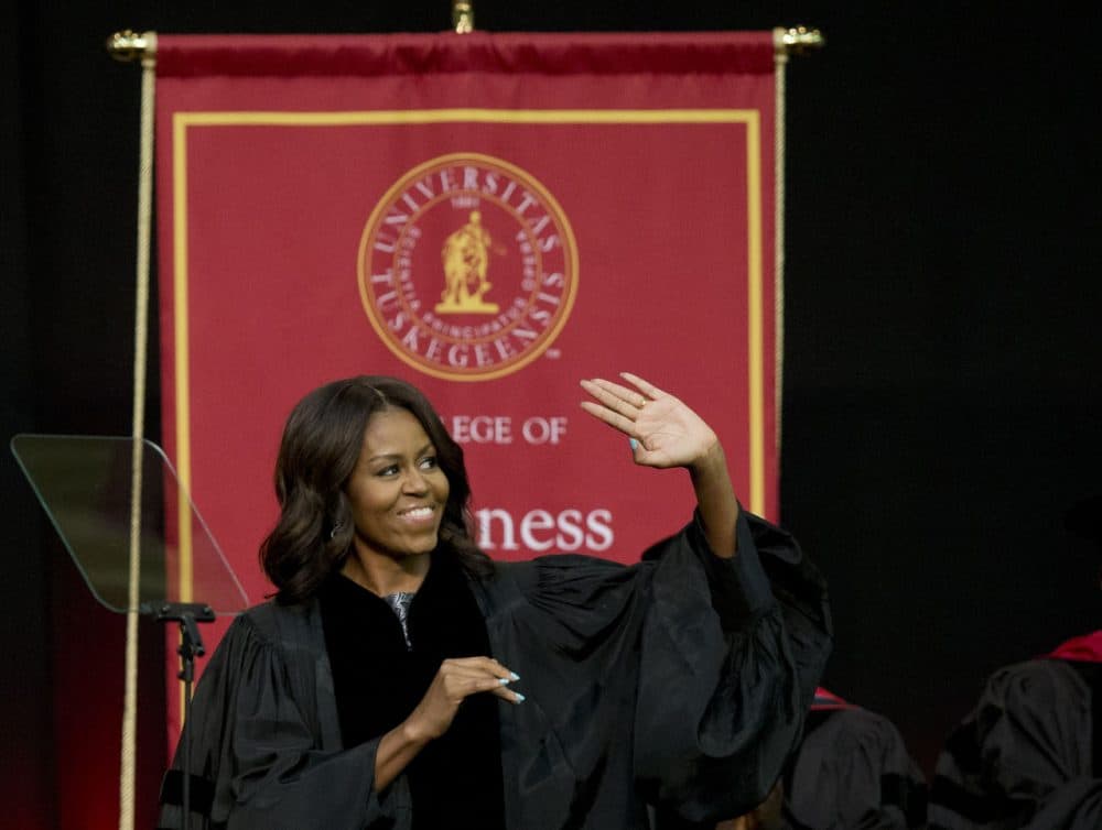 First lady Michelle Obama waves towards the crowd  just before she delivers the commencement address at Tuskegee University on Saturday.(Brynn Anderson/AP)