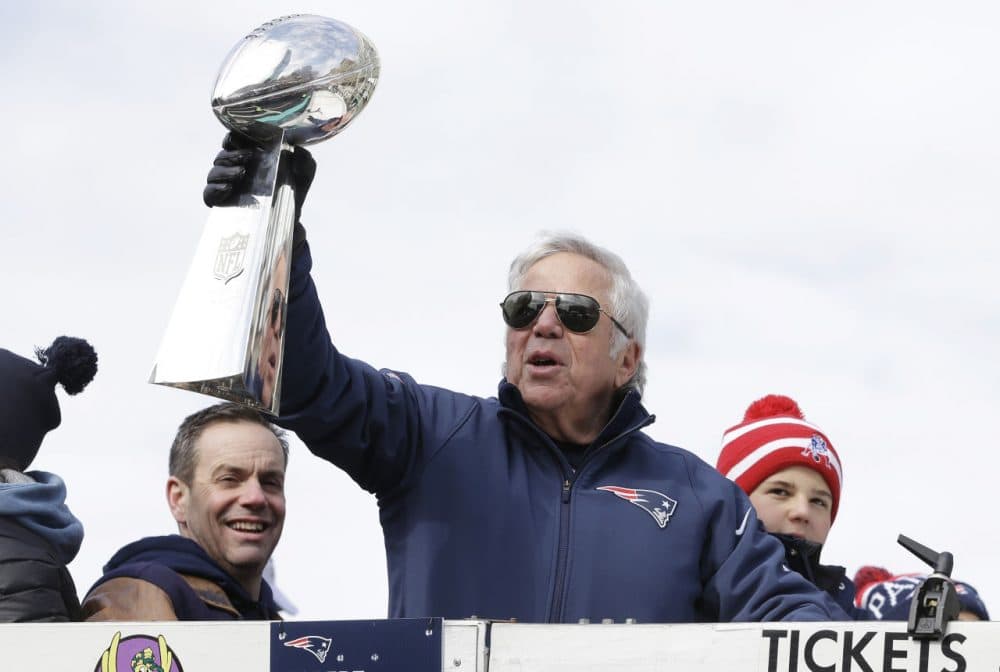 Patriots owner Robert Kraft shows off the Vince Lombardi Trophy during a parade in Boston in February to honor the Patriots' victory in Super Bowl XLIX. (Steven Senne/AP)
