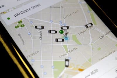 In this Wednesday, March 18, 2015, file photo, the Uber app displays cars available to make a pickup in downtown Manhattan on a smart phone, in New York.  (AP)