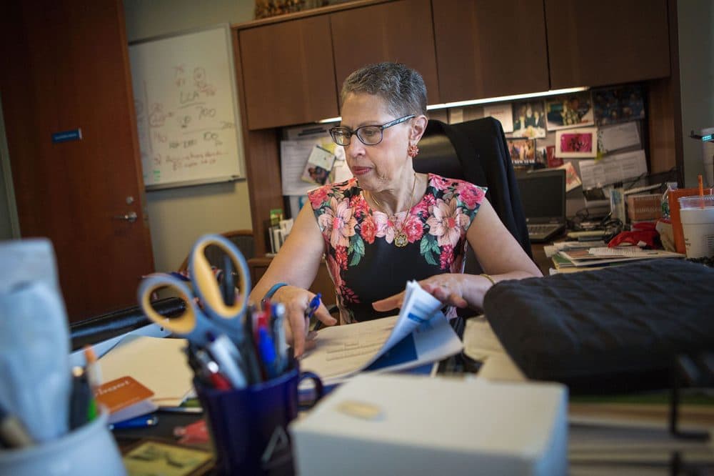 The outgoing director of the Massachusetts Life Sciences Center, Susan Windham-Bannister, sits at her desk in Waltham. (Jesse Costa/WBUR)