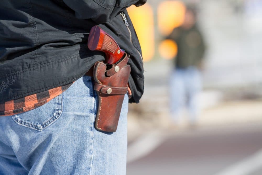 A woman wears her handgun in a holster. (weaverphoto/Flickr)