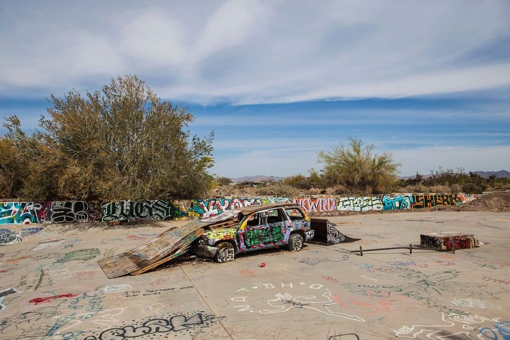 A car serves as the foundation for the Slab City skateboarding park, March 28, 2015. (Angela Carone)