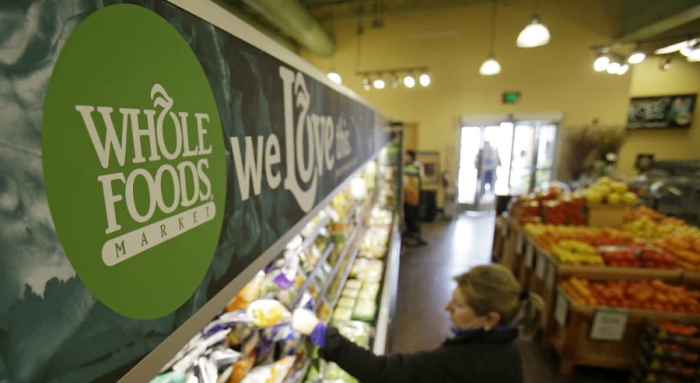 The upscale grocer practices &quot;conscious capitalism,&quot; but its workers and others still need programs like Obamacare. (Tony Dejak/AP)
