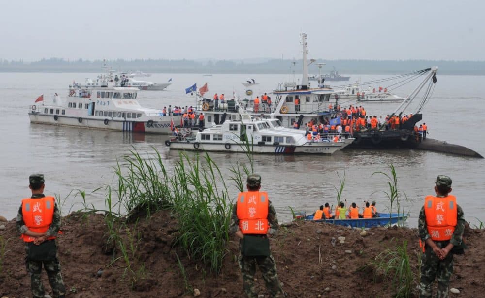 Rescue teams search for survivors near the Dongfangzhixing or 'Eastern Star' vessel which sank in the Yangtze river in Jianli, central China's Hubei province on June 2, 2015. Divers raced to find survivors on June 2 after a Chinese ship sank with more than 450 mainly elderly people in the storm-tossed Yangtze river, raising hopes more people can be found alive. (STR/AFP/Getty Images)