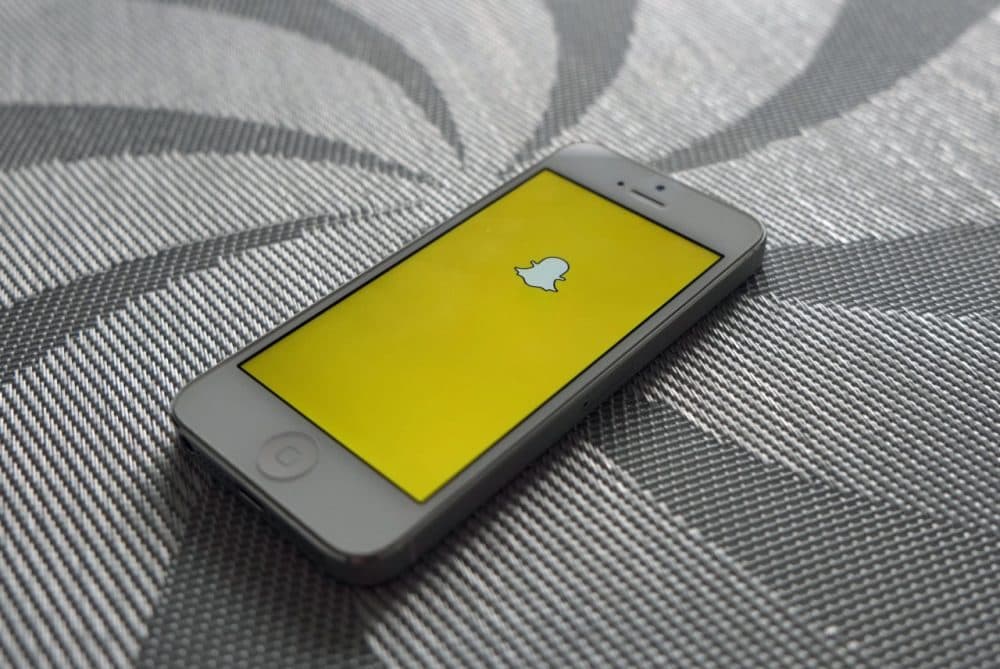 The Snapchat logo is pictured on an iPhone. (Adam Przezdziek/Flickr)