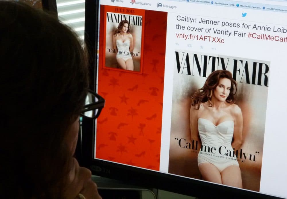 In this June 1, 2015 photo, a journalist looks at Vanity Fair's Twitter site with the Tweet about Caitlyn Jenner, who will be featured on the July cover of the magazine. Caitlyn Jenner, the transgender Olympic champion formerly known as Bruce, on Monday unveiled her new name and look in a sexy Vanity Fair cover shoot -- drawing widespread praise, including from the White House. Lesbian, gay, bisexual and transgender campaigners -- and many well-wishers -- welcomed the high-profile debut, as did the 65-year-old Jenner's family, which includes the media-savvy celebrity Kardashian clan. &quot;I'm so happy after such a long struggle to be living my true self,&quot; Jenner wrote in her first tweet after the magazine released the July cover photo by renowned photographer Annie Leibovitz. (Mladen Antonov/AFP/Getty Images)