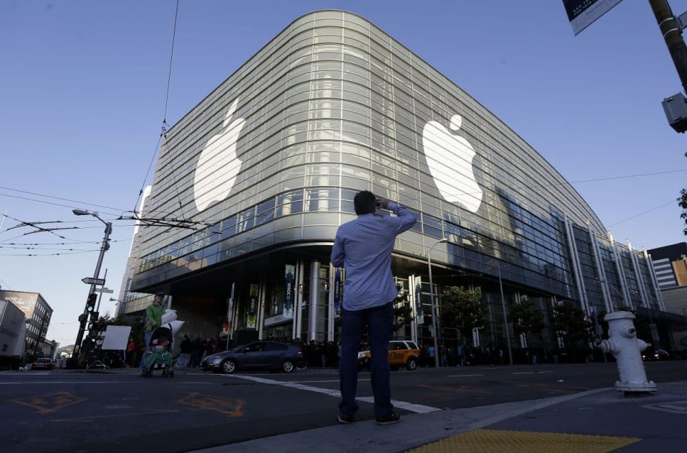 Apple logos adorn the exterior of the Moscone West building on the first day of the Apple Worldwide Developers Conference in San Francisco, Monday, June 8, 2015. The maker of iPods and iPhones is expected to announce its new, paid streaming-music service to launch this summer. (Jeff Chiu/AP)