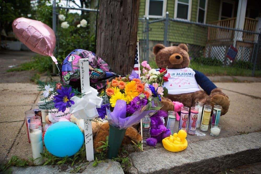 A memorial set up for 8-year-old hit and run victim Yadielys Deleon Camacho is seen Monday near the accident scene on West Selden Street in Mattapan. The accident happened Saturday. (Jesse Costa/WBUR)
