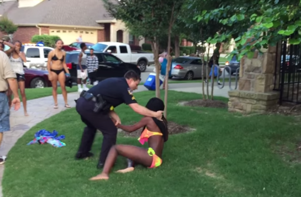 In this screenshot from YouTube, police officer Eric Casebolt pushes a 14-year-old girl to the ground.