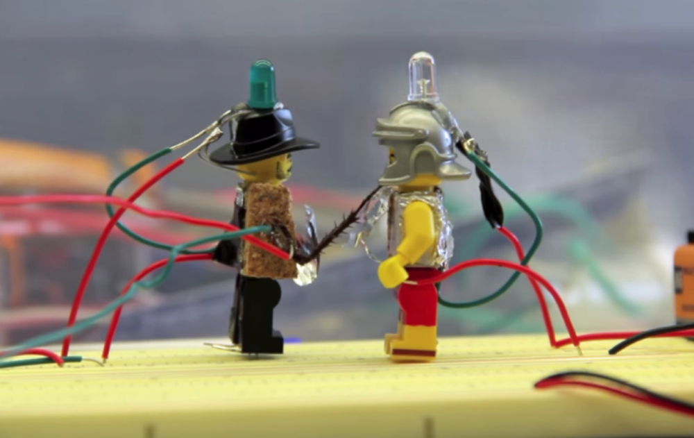Lego figures prepare to battle with cockroach legs. (Screenshot)