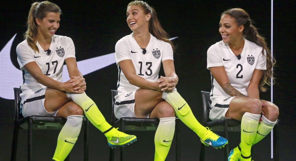 From left, U.S. team members Tobin Heath, Alex Morgan and Sydney Leroux pose in the a new black and white home uniforms for the U.S. Women's World Cup soccer team at a news conference in Los Angeles Wednesday, April 22, 2015. (Nick Ut/AP)