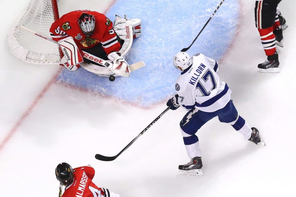 Corey Crawford #50 of the Chicago Blackhawks makes a save against Alex Killorn #17 of the Tampa Bay Lightning during Game Four of the 2015 NHL Stanley Cup Final at the United Center on June 10, 2015 in Chicago, Illinois. (Bruce Bennett/Getty Images)