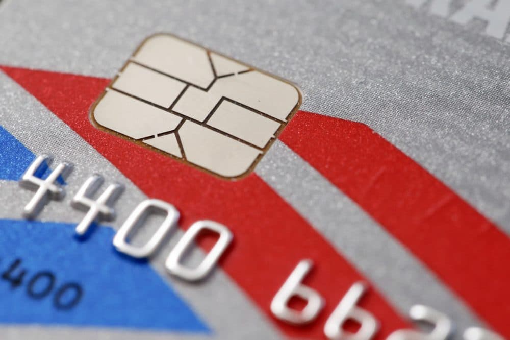 A chip-based credit card, in Philadelphia. U.S. banks, tired of spending billions a year to pay back fleeced consumers, are in the process of replacing tens of millions of old magnetic strip credit and debit cards with new cards that are equipped with computer chips that store account data more securely. (Matt Rourke/AP)