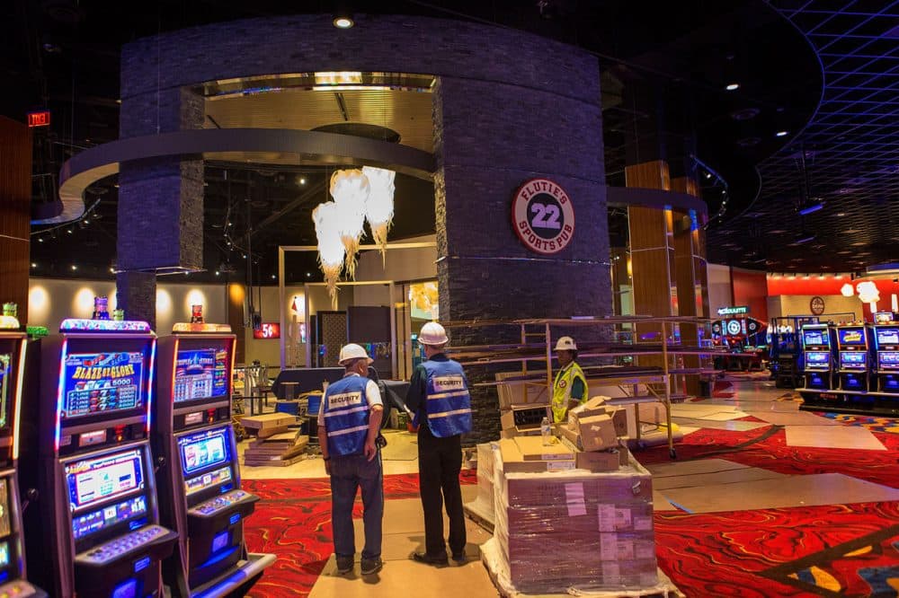 Workers  survey Plainridge Park Casino, the state's lone slots parlor, which opens on June 24. (Jesse Costa/WBUR)