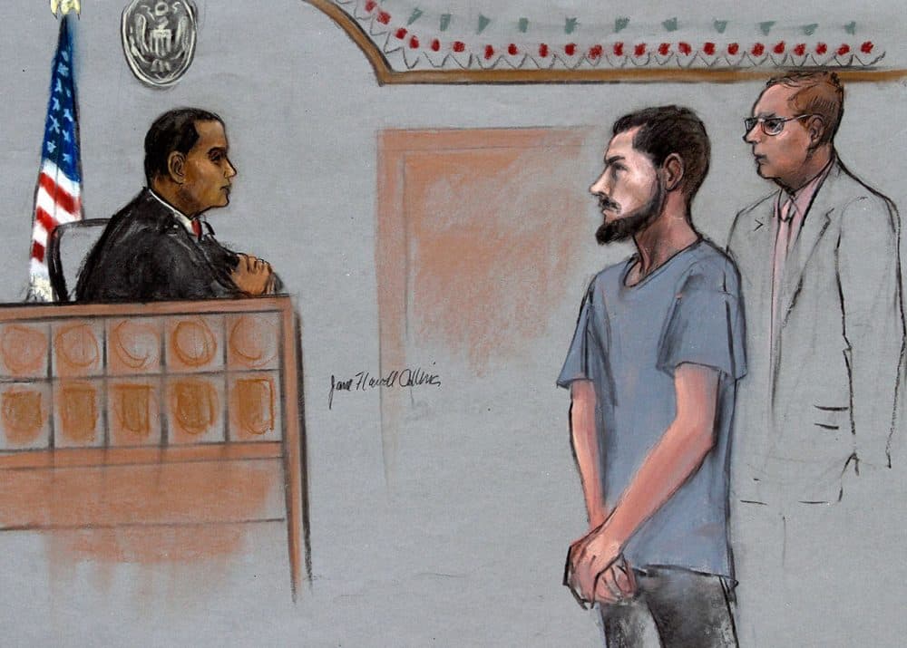 In this courtroom sketch, Nicholas Rovinski, second from right, of Warwick, R.I., is depicted standing with his attorney William Fick, right, as Magistrate Judge Donald Cabell presides during a hearing in federal court in Boston. (Jane Flavell Collins via AP)
