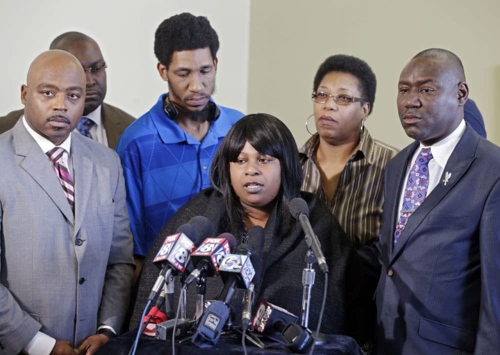 Samaria Rice, center, speaks about the investigation into the death of her son Tamir Rice, at a news conference with attorneys Walter Madison, left, and Benjamin Crump in Cleveland on  Jan. 6, 2015. (Mark Duncan/AP)