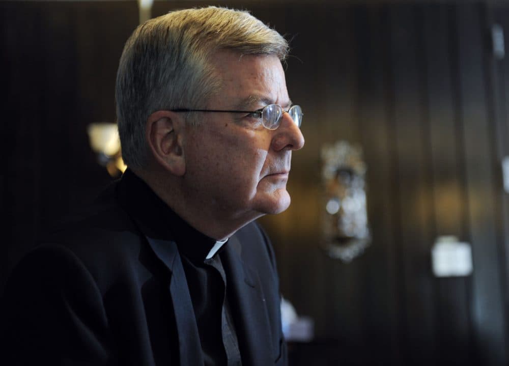 Archbishop John Nienstedt talks with a reporter at his office in St. Paul, Minn.  after a law firm hired by the Archdiocese of St. Paul and Minneapolis finished its investigation of allegations of sexual misconduct with adults by Archbishop Nienstedt, Wednesday, July 30, 2014.(Craig Lassig/AP)