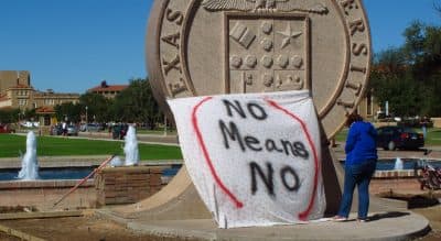 Harvey Silverglate: Massachusetts should pass the “right to counsel” bill to reflect the reality of shadow criminal justice systems on our campuses. In this Wednesday, Oct. 1, 2014 file photo, a student at Texas Tech helps drape a bed sheet with the message &quot;No Means No&quot; over the university's seal to protest what students say is a &quot;rape culture&quot; on campus. (Betsy Blaney/AP)
