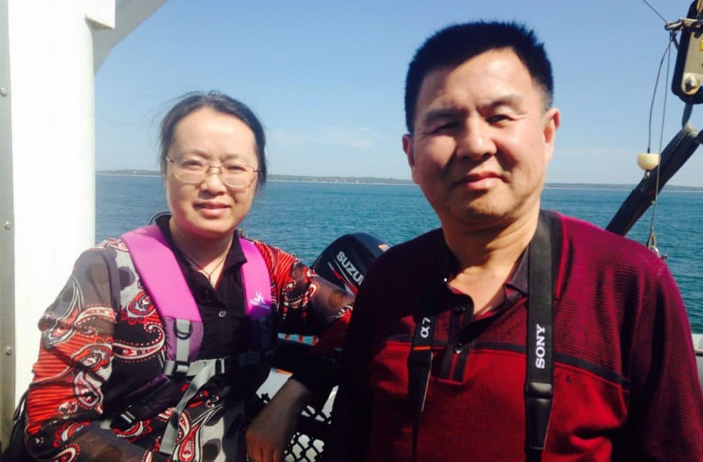 Chinese tourists Zhang Jie and He Anrong pose for a photo on the ferry to Martha's Vineyard, off the coast of Massachusetts. (Peter O'Dowd)