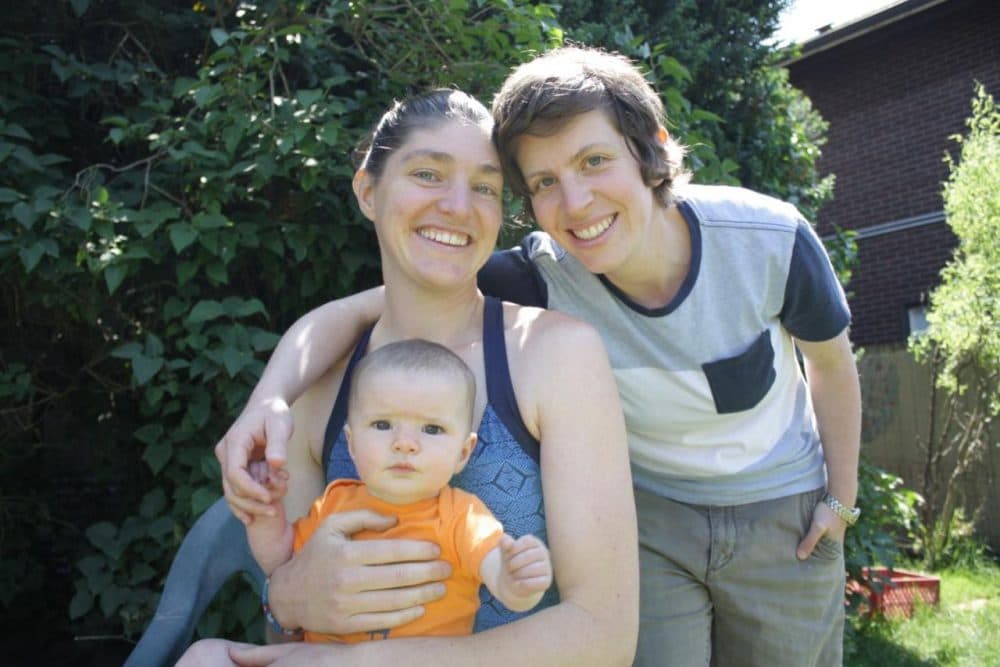 Seattle moms Sarah Weigle and Julia Crouch and their daughter Maya. Although married in Washington state, Crouch chose to adopt their daughter to protect her status as a parent across the U.S.
(Joshua McNichols/KUOW)