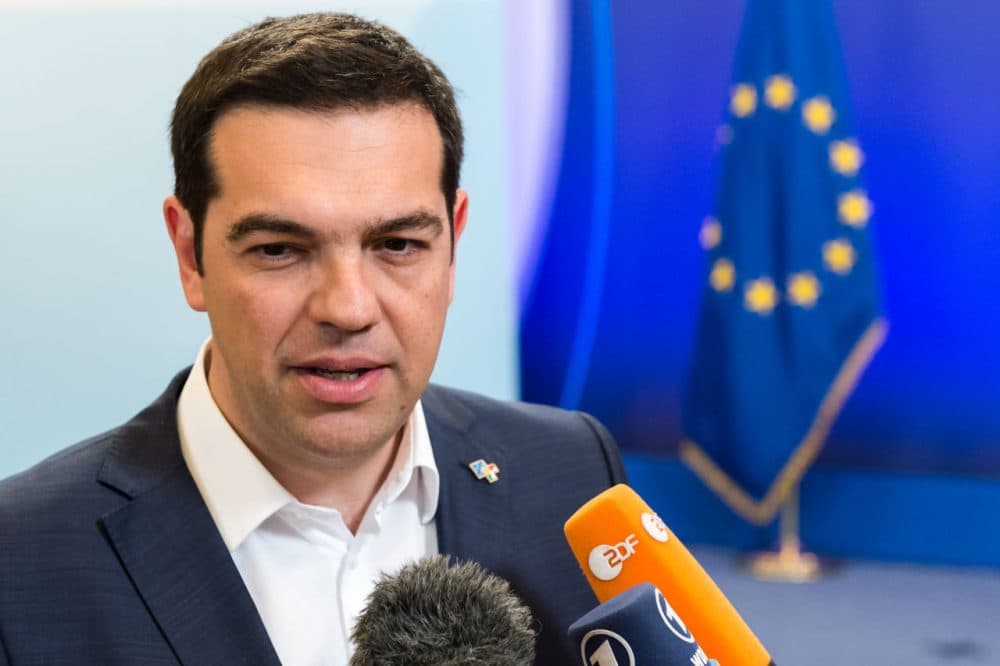 Greek Prime Minister Alexis Tsipras talks to the media as he leaves after he participated in a bilateral meeting with European Commission President Jean-Claude Juncker on the sidelines of the EU meetings in Brussels on Thursday, June 11, 2015. (Geert Vanden Wijngaert/AP)