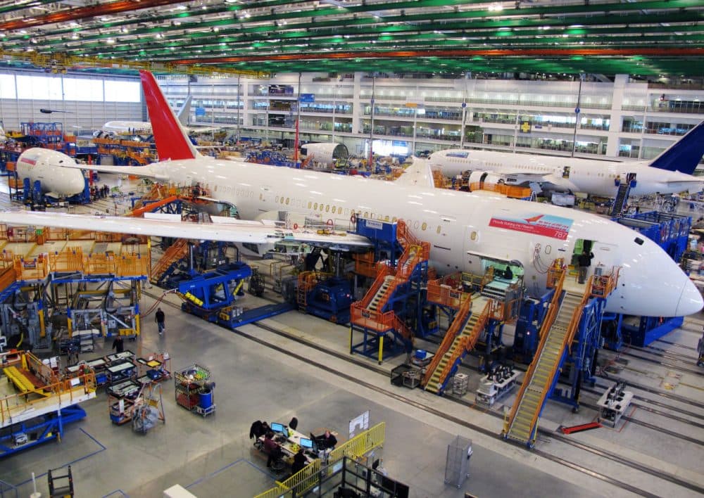 Workers assemble Boeing 787 Dreamliners in the company's massive assembly plant in North Charleston, S.C., Dec. 19, 2013. (Bruce Smith/AP)