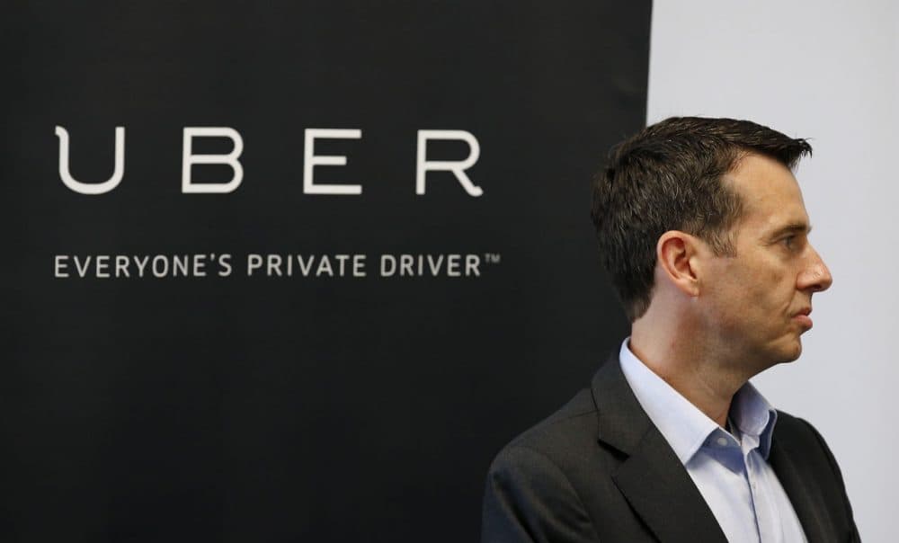 David Plouffe, Uber senior vice president of policy and communications, listens as Arizona Gov. Doug Ducey speaks at the opening of the new Uber offices Thursday, June 11, 2015, in Phoenix.  The ride-hailing firm opens their new customer service center that is expected to eventually have several hundred employees. (Ross D. Franklin/AP)
