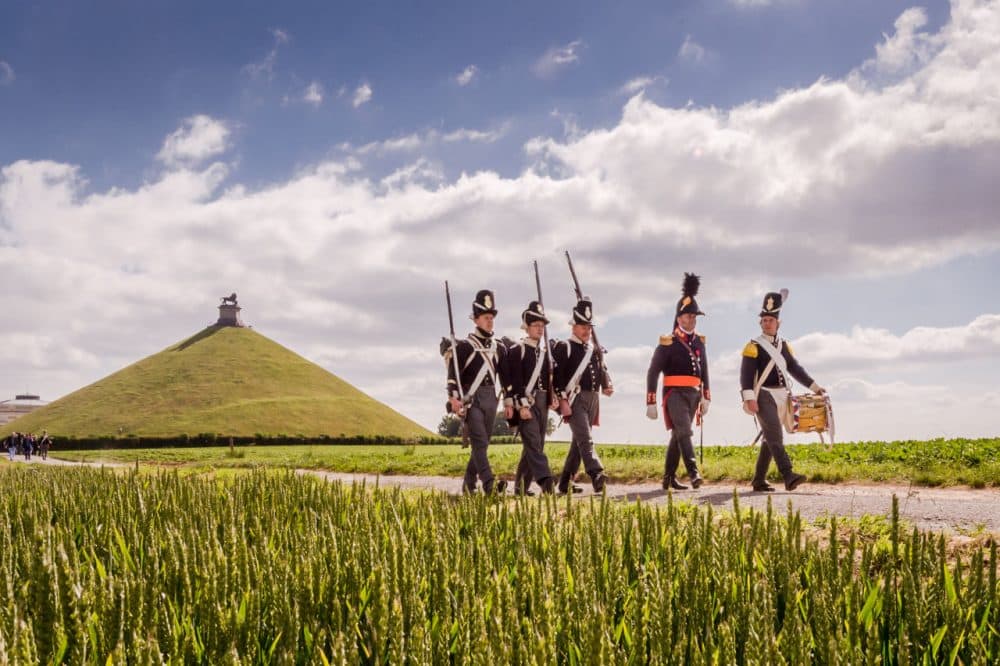 Battle of Waterloo re-enactors walk near the Lion's Mound during a historical walk for journalists in Braine-l'Alleud, near Waterloo, Belgium. On Wednesday, June 17, 2015, four days of commemoration will begin on the historic battlefield, with the re-opening of Hougoumont farm and a reconstruction of the battle with more than 5,000 re-enactors. (Geert Vanden Wijngaert/AP)