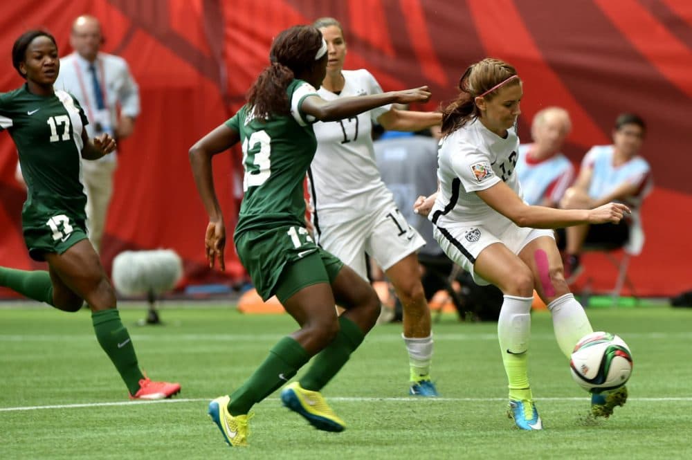 Alex Morgan #13 of the United States kicks the ball against Ngozi Okobi #13 of Nigeria in the second half in the Group D match of the FIFA Women's World Cup Canada 2015 at BC Place Stadium on June 16, 2015 in Vancouver, Canada. (Rich Lam/Getty Images)
