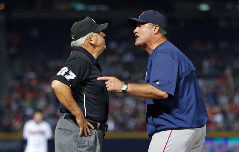 Boston Red Sox manager John Farrell (R) argues with umpire Larry Vanover in the seventh inning of a baseball game against the Atlanta Braves Wednesday, June 17, 2015, in Atlanta. (John Bazemore/AP)