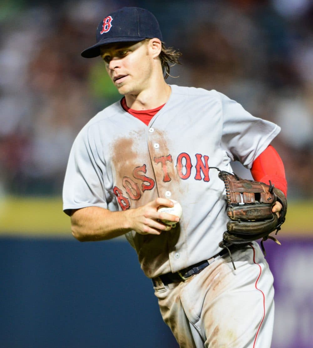 Boston Red Sox second baseman Brock Holt runs in the ball after making a catch to end the eighth inning of a game Thursday, June 18, 2015, in Atlanta. (Jon Barash/AP)