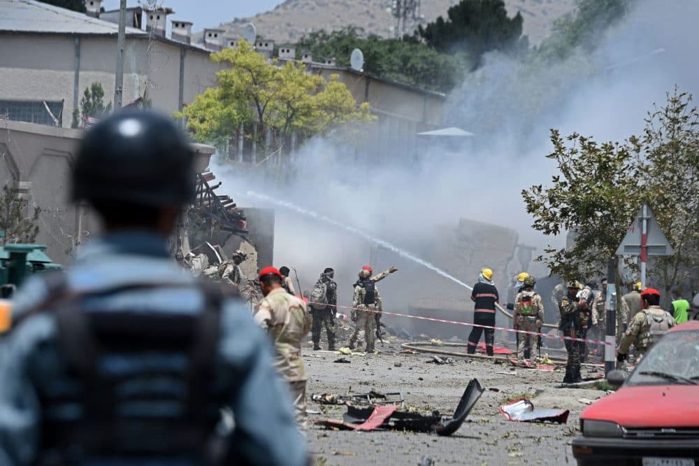 Afghan firefighters work to put out a fire at the site of a suicide an attack on the Afghan parliament building in Kabul on June 22, 2015. Taliban militants attacked the Afghan parliament on June 22, with gunfire and explosions rocking the building, sending lawmakers running for cover in chaotic scenes relayed live on television. The insurgents tried to storm the complex after triggering a car bomb but were repelled and have taken position in a partially-constructed building nearby, officials said about the ongoing attack. All MPs were safely evacuated after the attack, which came as the Afghan president's nominee for the crucial post of defence minister was to be introduced in parliament. (Wakil Kohsar/AFP/Getty Images)