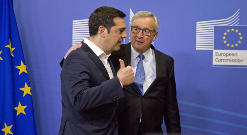 Greek Prime Minister Alexis Tsipras, left, speaks with European Commission President Jean-Claude Juncker as he arrives for a meeting prior to an EU summit at EU headquarters in Brussels on Monday, June 22, 2015. Heads of state in the eurogroup will meet in Brussels on Monday for a special summit to discuss the financial crisis with Greece. (Virginia Mayo/AP)